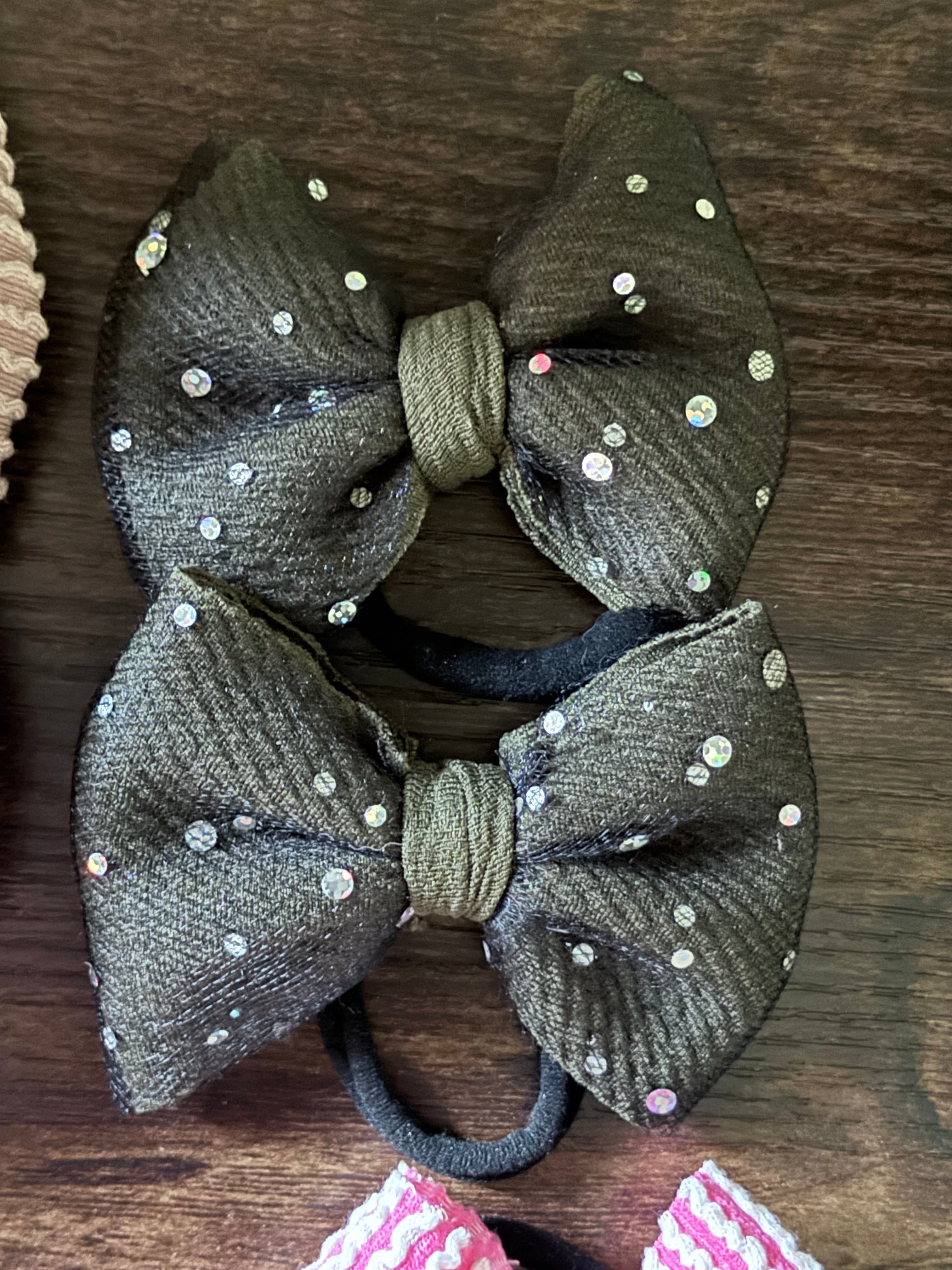 Tiny green pig tail bows