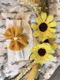 White lace wrap with mustard yellow bow