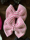 Small pink pig tail bows