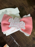 Large pink bow clip with patch